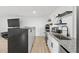 Modern kitchen with stainless steel appliances, granite countertops, and a breakfast bar at 2949 Summitop Ne Ct, Marietta, GA 30066