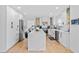 Spacious kitchen featuring an island with marble countertops, stainless steel appliances, and hardwood floors at 2949 Summitop Ne Ct, Marietta, GA 30066