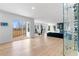 Open-concept living room with access to a deck, a dining area, and modern decor at 2949 Summitop Ne Ct, Marietta, GA 30066
