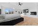 Bright main bedroom with a cozy bed, hardwood floors, and a fireplace at 2949 Summitop Ne Ct, Marietta, GA 30066