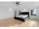 Spacious main bedroom featuring hardwood floors, a large bed, and a walk-in closet at 2949 Summitop Ne Ct, Marietta, GA 30066