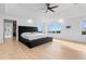 Bright main bedroom boasts a large window, tray ceiling, hardwood floors, and a walk-in closet at 2949 Summitop Ne Ct, Marietta, GA 30066