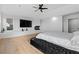 Bright main bedroom with hardwood floors, fireplace, and a ceiling fan at 2949 Summitop Ne Ct, Marietta, GA 30066