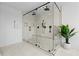 Large walk-in shower with glass doors and rain shower head, also features black hardware at 2949 Summitop Ne Ct, Marietta, GA 30066