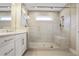 Bathroom featuring a glass-enclosed shower with a built-in bench, tiled walls and floors at 3533 Koyla Lndg # 5, Chamblee, GA 30341