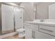 Bathroom with a glass-enclosed shower, white vanity, chrome fixtures, and neutral tile at 3533 Koyla Lndg # 5, Chamblee, GA 30341