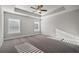Spacious bedroom featuring a trey ceiling, neutral walls, carpet and plenty of natural light at 3533 Koyla Lndg # 5, Chamblee, GA 30341
