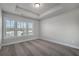 Bright bedroom featuring a trey ceiling, neutral walls, carpet and plenty of natural light at 3533 Koyla Lndg # 5, Chamblee, GA 30341