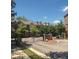 View of the townhome community entrance featuring landscaped greenery and an iron gate at 3533 Koyla Lndg # 5, Chamblee, GA 30341