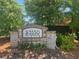 Close up view of the community signage in front of mature green trees and landscaping at 3533 Koyla Lndg # 5, Chamblee, GA 30341
