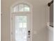 Bright entryway featuring a door with transom window, digital lock, and wood-look flooring at 3533 Koyla Lndg # 5, Chamblee, GA 30341