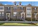 Charming townhome with brick and stone facade, small yard, and inviting entryway at 3533 Koyla Lndg # 5, Chamblee, GA 30341