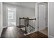 Upstairs hallway with hardwood floors, stairs, and views into other rooms at 3533 Koyla Lndg # 5, Chamblee, GA 30341
