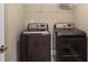 A convenient laundry room featuring a washer and dryer and wire shelving for storage at 3533 Koyla Lndg # 5, Chamblee, GA 30341