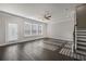 Inviting living room with hardwood floors, staircase, ceiling fan, and natural light at 3533 Koyla Lndg # 5, Chamblee, GA 30341