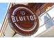 A rustic sign for Bluetop Restaurant & Bar in Chamblee, Georgia, with weathered wood and metal accents at 3533 Koyla Lndg # 5, Chamblee, GA 30341