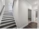 Elegant staircase with dark wood steps, white risers, and access to a hallway at 3533 Koyla Lndg # 5, Chamblee, GA 30341