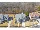 An aerial view of the home shows the roof and layout within its neighborhood and wooded surroundings at 4815 Westgate Dr, Cumming, GA 30040