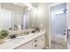 Bathroom with double sink, modern fixtures and a tiled shower at 4815 Westgate Dr, Cumming, GA 30040