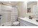 Cozy bathroom features a clean vanity and a shower with a stylish shower curtain at 4815 Westgate Dr, Cumming, GA 30040