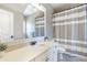 Neutral bathroom featuring a shower-tub combo with a striped curtain at 4815 Westgate Dr, Cumming, GA 30040