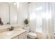 Well-lit bathroom with a standalone shower and a classic vanity with ample storage at 4815 Westgate Dr, Cumming, GA 30040