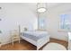 Cozy bedroom with hardwood floors, light walls, and large windows with plantation shutters at 4815 Westgate Dr, Cumming, GA 30040