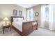 Bedroom featuring hardwood furniture, carpet, and natural lighting at 4815 Westgate Dr, Cumming, GA 30040