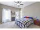 Bedroom with a ceiling fan, natural light, and neutral walls at 4815 Westgate Dr, Cumming, GA 30040