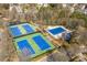 Aerial view of a community's recreational amenities including tennis and basketball courts plus a pool area at 4815 Westgate Dr, Cumming, GA 30040