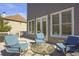 Relaxing deck with a patio set and view to a neighboring home and treeline at 4815 Westgate Dr, Cumming, GA 30040