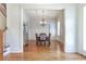 Elegant dining room featuring hardwood floors, wainscoting, and a stylish chandelier at 4815 Westgate Dr, Cumming, GA 30040