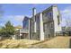 View of the rear elevation showing an expansive yard and deck at 4815 Westgate Dr, Cumming, GA 30040