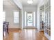 Bright foyer showcasing hardwood floors, white trim, and a glimpse of the living spaces at 4815 Westgate Dr, Cumming, GA 30040