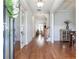 Elegant foyer featuring hardwood floors, wainscoting, and a view of the staircase at 4815 Westgate Dr, Cumming, GA 30040