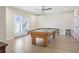 Bright basement game room with pool table and French door access at 4815 Westgate Dr, Cumming, GA 30040