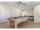 Spacious game room with modern billiard table and ample lighting at 4815 Westgate Dr, Cumming, GA 30040