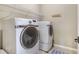 Laundry room features updated Samsung washer and dryer with shelving at 4815 Westgate Dr, Cumming, GA 30040