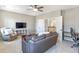 The room features a ceiling fan, a sectional, and a view of the landing at 4815 Westgate Dr, Cumming, GA 30040