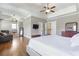Bright bedroom featuring hardwood floors, a sitting area and an ensuite bathroom at 4815 Westgate Dr, Cumming, GA 30040