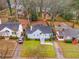 Aerial view of a well-maintained home nestled among mature trees, featuring a green lawn at 1318 Beecher St, Atlanta, GA 30310