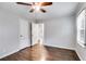 This spacious bedroom features hardwood floors, a ceiling fan, and ample natural light at 1318 Beecher St, Atlanta, GA 30310