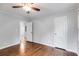 Bedroom with hardwood floors, neutral paint, and closet space at 1318 Beecher St, Atlanta, GA 30310