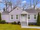 Charming home featuring a light grey brick facade, well-kept lawn, and welcoming front entrance at 1318 Beecher St, Atlanta, GA 30310