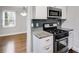 Well-appointed kitchen with granite countertops and stainless steel appliances offers a modern aesthetic at 1318 Beecher St, Atlanta, GA 30310