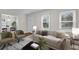 Bright living room with hardwood floors, neutral paint, and ample natural light from multiple windows at 1318 Beecher St, Atlanta, GA 30310