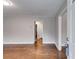 A spacious living room offers hardwood floors and neutral color walls, providing an airy atmosphere at 1318 Beecher St, Atlanta, GA 30310