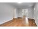 Open-concept living room featuring hardwood floors and neutral paint at 1318 Beecher St, Atlanta, GA 30310