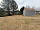View of the backyard, featuring a large storage shed for outdoor equipment and tools at 1631 Royal Ives Dr, Lawrenceville, GA 30045