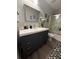 Bathroom with a large mirror, vanity, and walk-in shower at 1631 Royal Ives Dr, Lawrenceville, GA 30045